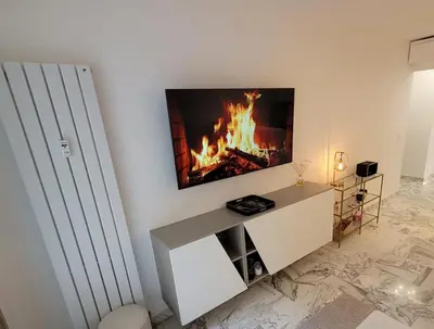 Télévision ou salle de divertissement dans l'établissement Bell Appartement Cannes