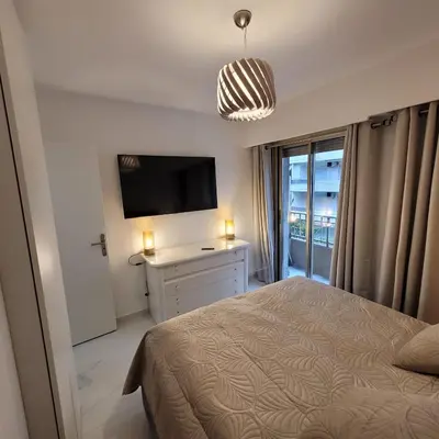 Un ou plusieurs lits dans un hébergement de l'établissement Bell Appartement Cannes