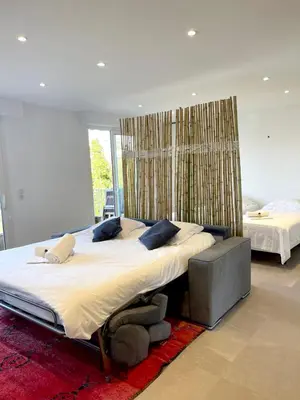 Un ou plusieurs lits dans un hébergement de l'établissement Le Cèdre Magnifique Appartement à Cannes