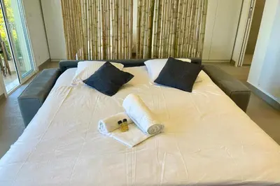Un ou plusieurs lits dans un hébergement de l'établissement Le Cèdre Magnifique Appartement à Cannes