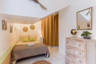 Un ou plusieurs lits dans un hébergement de l'établissement La Maison Fleurie by Halldis