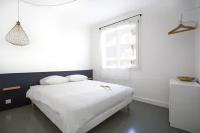 Un ou plusieurs lits dans un hébergement de l'établissement Appartement 3 pièces / proche plage / centre / clim