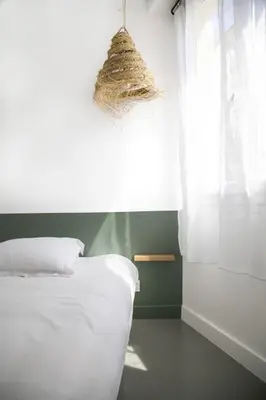 Un ou plusieurs lits dans un hébergement de l'établissement Appartement 3 pièces / proche plage / centre / clim