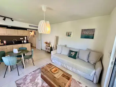 Coin salon dans l'établissement B035 Magnifique appartement neuf a deux pas du centre