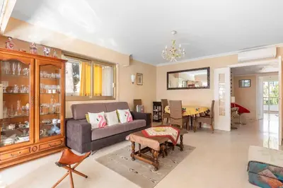 Coin salon dans l'établissement Appartement vue piscine, proche mer