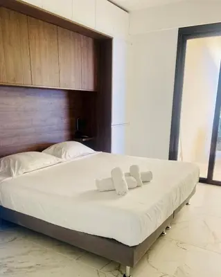 Un ou plusieurs lits dans un hébergement de l'établissement Appart 2P Vue Mer Panoramique Cannes Eden