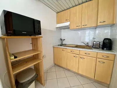 Cuisine ou kitchenette dans l'établissement Cannes proche croisette - Studio balcon vue jardin