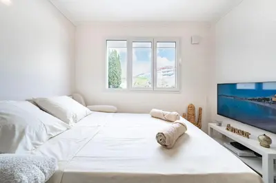 Un ou plusieurs lits dans un hébergement de l'établissement Studio Banane 2 min croisette mitoyen Martinez