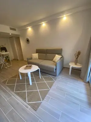 Coin salon dans l'établissement Appartement neuf Pointe Croisette, 50 m de la mer