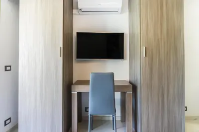 Télévision ou salle de divertissement dans l'établissement Isola Bella by Connexion