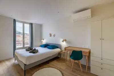Un ou plusieurs lits dans un hébergement de l'établissement BRP Cannes Center,Top floor Luxurious house,8 bed