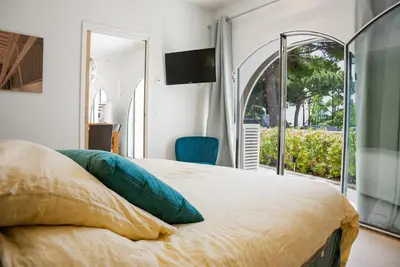 Un ou plusieurs lits dans un hébergement de l'établissement Superbe Villa-Appartement sur la Croisette avec grande terrasse
