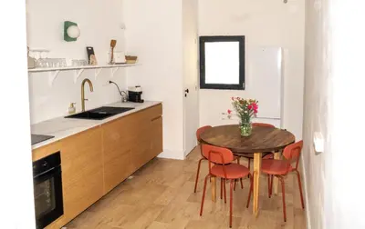 Cuisine ou kitchenette dans l'établissement La maison by Simone T3