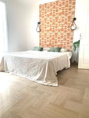 Un ou plusieurs lits dans un hébergement de l'établissement La Maison by Simone, la vrai