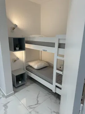 Un ou plusieurs lits dans un hébergement de l'établissement Residence Graziella Appartement 109