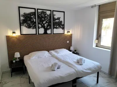 Un ou plusieurs lits dans un hébergement de l'établissement Residence Graziella Appartement 109