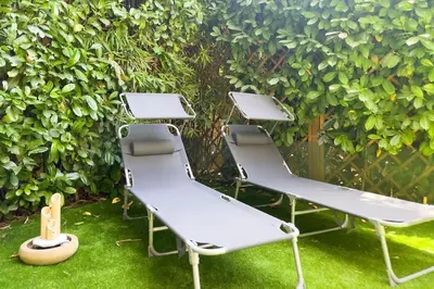 Jardin de l'établissement Cocon paradisiaque avec piscine, terrasse, jardin au calme absolu