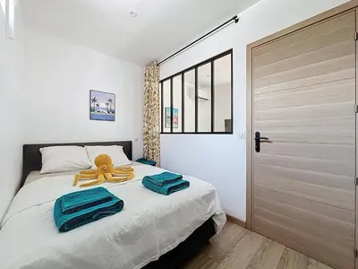 Un ou plusieurs lits dans un hébergement de l'établissement Appartement cosy et climatisé proche mer