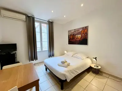 Un ou plusieurs lits dans un hébergement de l'établissement Viva Riviera Residence Rue Florian close Croisette