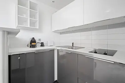 Cuisine ou kitchenette dans l'établissement Studio Velasquez - Welkeys