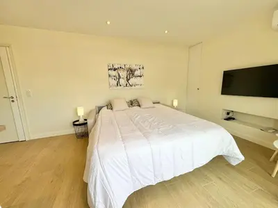 Un ou plusieurs lits dans un hébergement de l'établissement Le studio Palm Beach, Clim ,Parking, Neuf