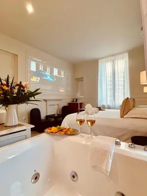 Un ou plusieurs lits dans un hébergement de l'établissement Maison LYO logement Luxe
