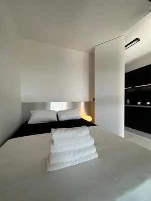Un ou plusieurs lits dans un hébergement de l'établissement Appartement Design élégant