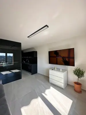 Télévision ou salle de divertissement dans l'établissement Appartement Design élégant