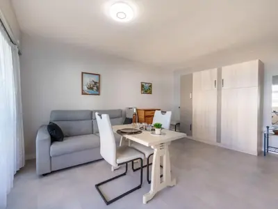 Coin salon dans l'établissement Apartment Le Copacabana by Interhome
