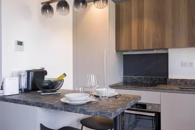Cuisine ou kitchenette dans l'établissement Studio Jules - Bd de Lorraine