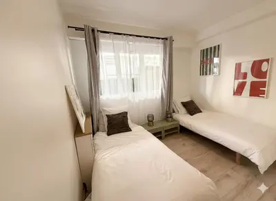 Un ou plusieurs lits dans un hébergement de l'établissement Appartement terrasse Croisette