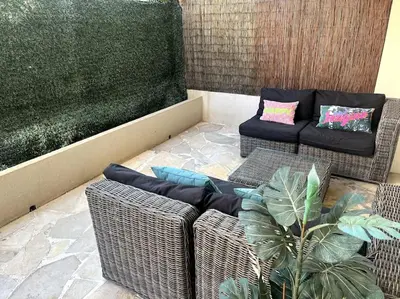 Coin salon dans l'établissement Appartement terrasse Croisette