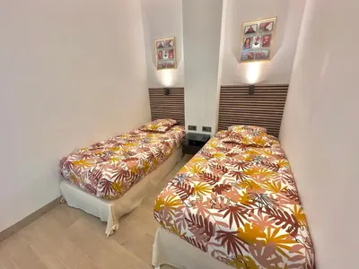 Un ou plusieurs lits dans un hébergement de l'établissement Cosy Home Cannes - Croisette