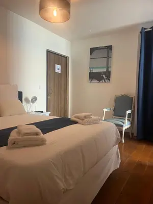 Un ou plusieurs lits dans un hébergement de l'établissement Villa Gabriel