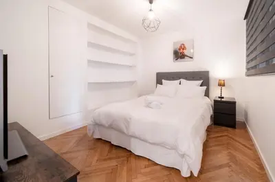Un ou plusieurs lits dans un hébergement de l'établissement Triplex Gallia Luxe Cannes