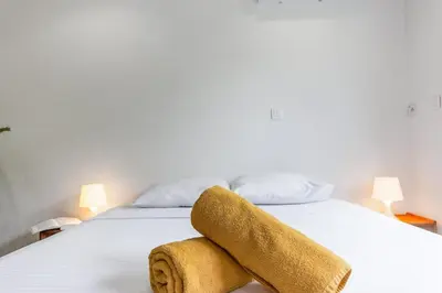 Un ou plusieurs lits dans un hébergement de l'établissement L'Emeraude - Calme - Plage - WIFI