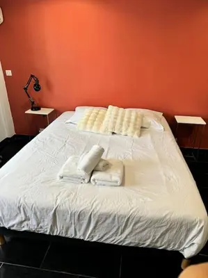 Un ou plusieurs lits dans un hébergement de l'établissement Grand Studio Centre Cannes