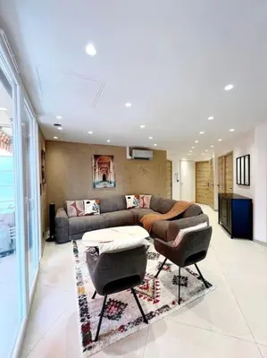 Coin salon dans l'établissement Appartement 4 pièces luxueux