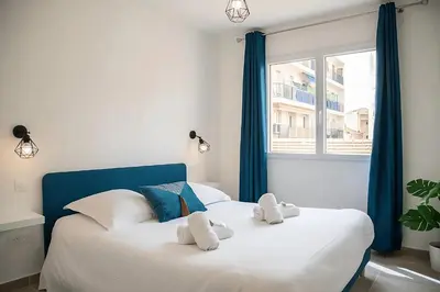 Un ou plusieurs lits dans un hébergement de l'établissement Appartement tout confort au Cœur d'Antibes