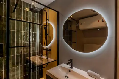 Salle de bains dans l'établissement Le Grand Hôtel -Centre Croisette