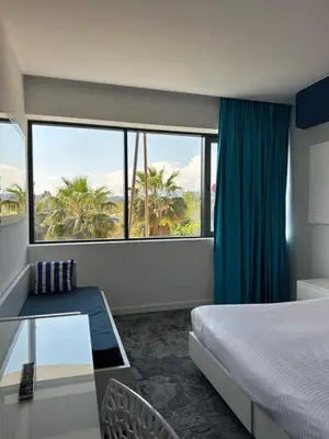 Un ou plusieurs lits dans un hébergement de l'établissement SoBlue Hôtel