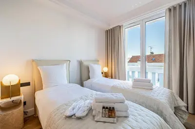 Un ou plusieurs lits dans un hébergement de l'établissement 1974 - Luxurious 3 bedrooms - Sea view & Parking