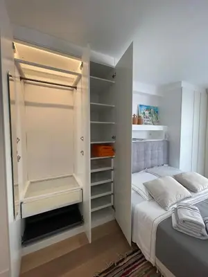 Un ou plusieurs lits dans un hébergement de l'établissement Superbe studio pour congrés au coeur de Cannes