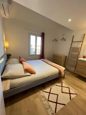 Un ou plusieurs lits dans un hébergement de l'établissement Le Nid d Azur Duplex vue Mer Centre Ville