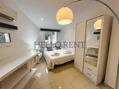Un ou plusieurs lits dans un hébergement de l'établissement Grande Villa Cannes Centre havre de paix