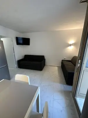 Télévision ou salle de divertissement dans l'établissement Résidence Graziella Studio 406