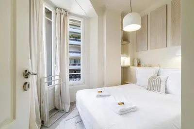 Un ou plusieurs lits dans un hébergement de l'établissement Cannes banana apartment