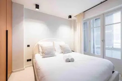 Un ou plusieurs lits dans un hébergement de l'établissement Pasteur Luxury apartment la Croisette
