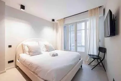 Un ou plusieurs lits dans un hébergement de l'établissement Pasteur Luxury apartment la Croisette