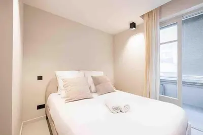 Un ou plusieurs lits dans un hébergement de l'établissement Pasteur Luxury apartment la Croisette